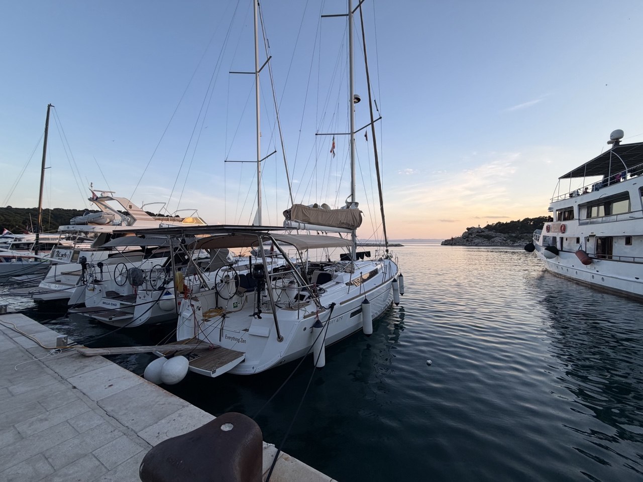 Everything Zen stern in a calm marina at sunset