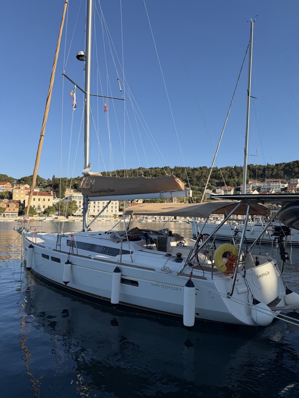Everything Zen side and stern view with marina town buildings behind