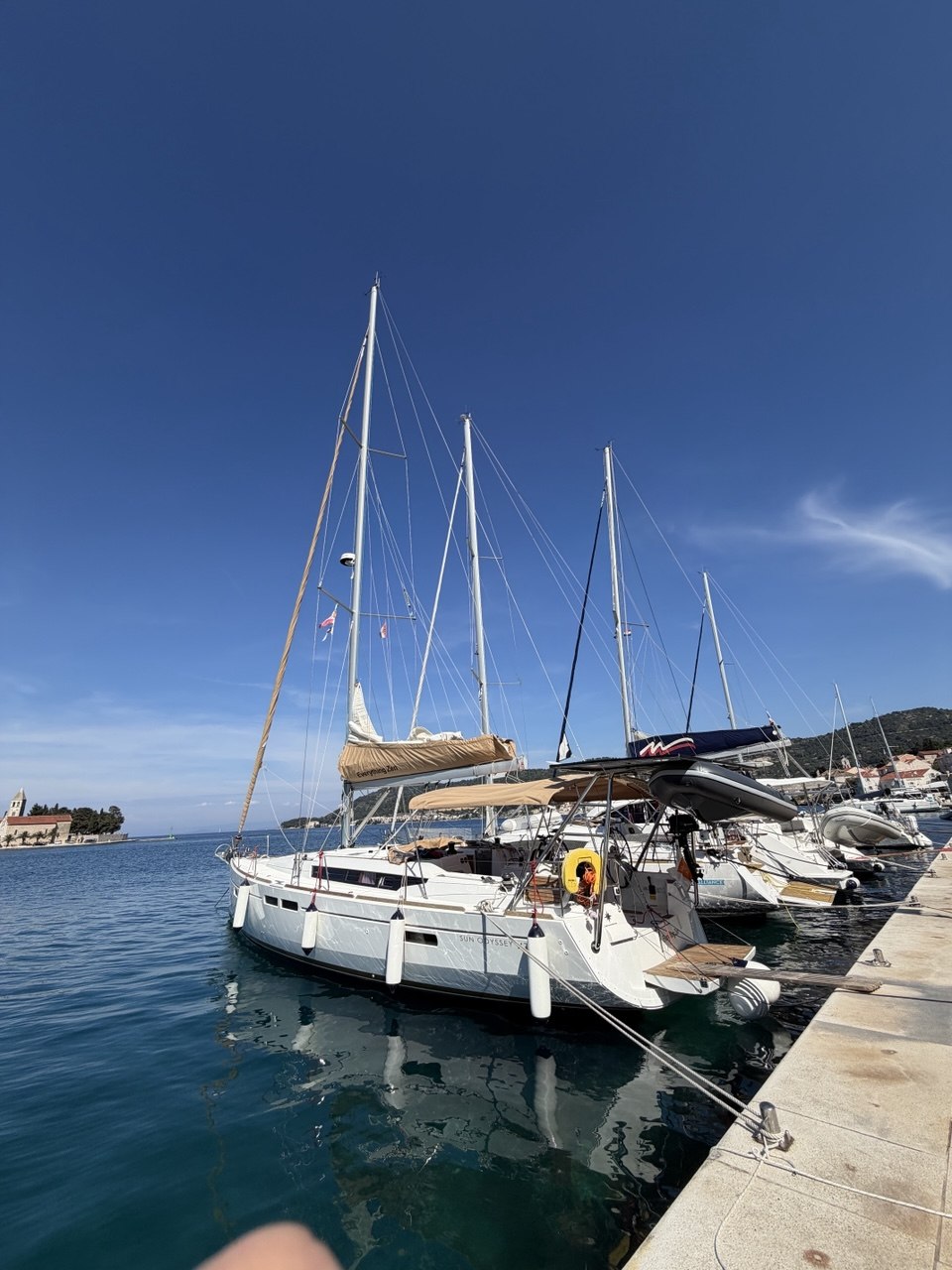 Everything Zen moored with tall masts and blue sky