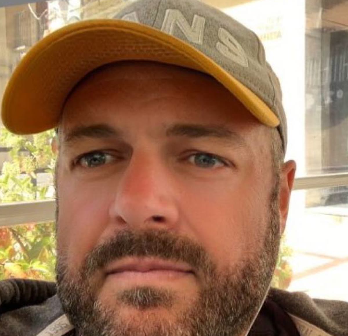 Kev wearing a cap in a close-up portrait