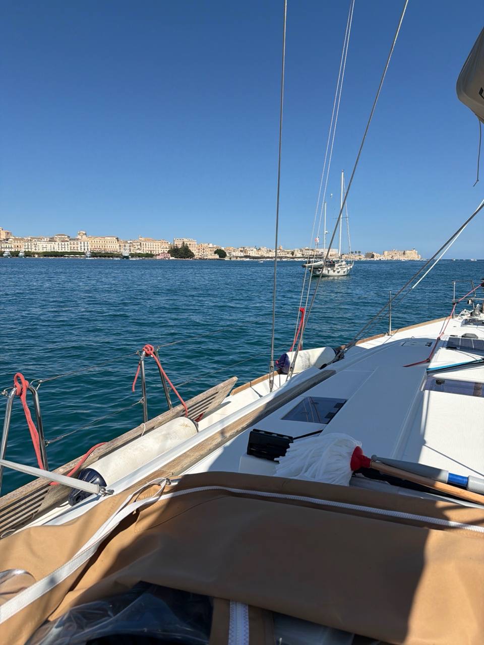 Everything Zen at anchor in Porto Grande with Ortigia and Siracusa skyline ahead